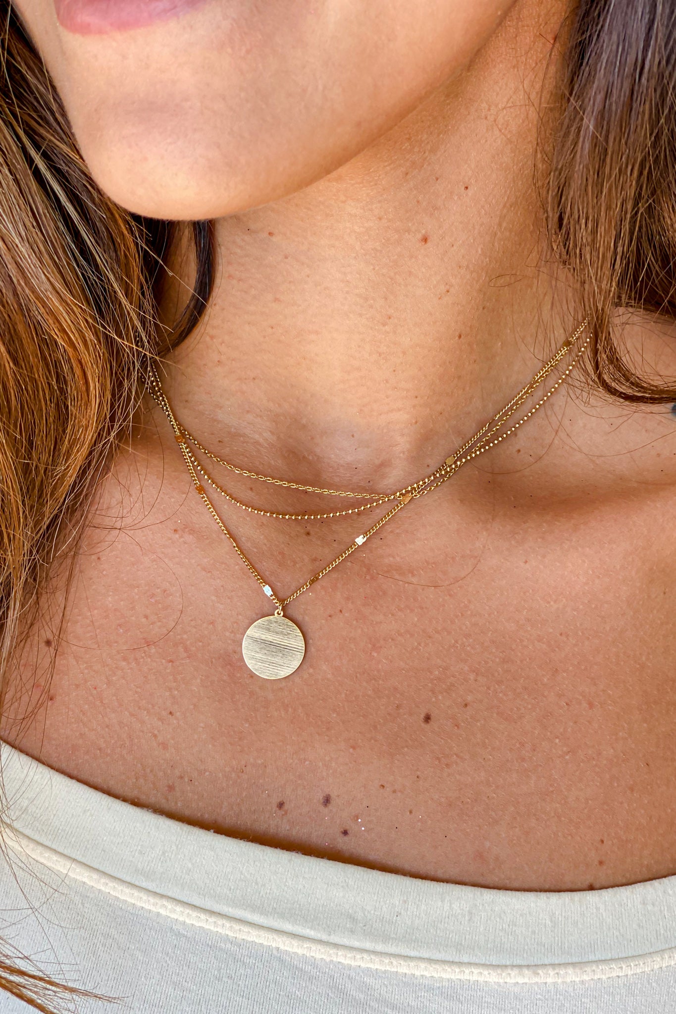 Stylish Gold Layered Necklace with Shiny Disc Pendant